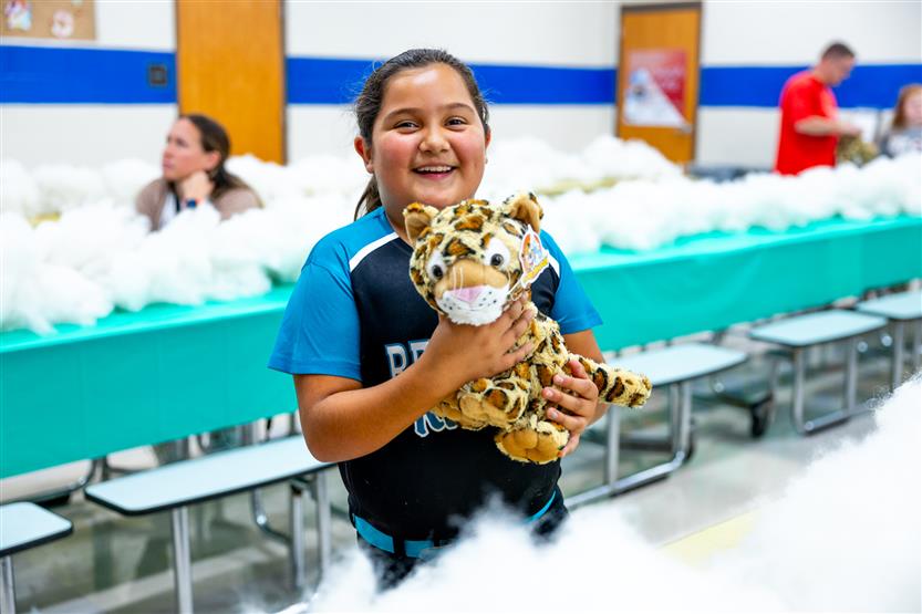 Students build a cheetah at a community event